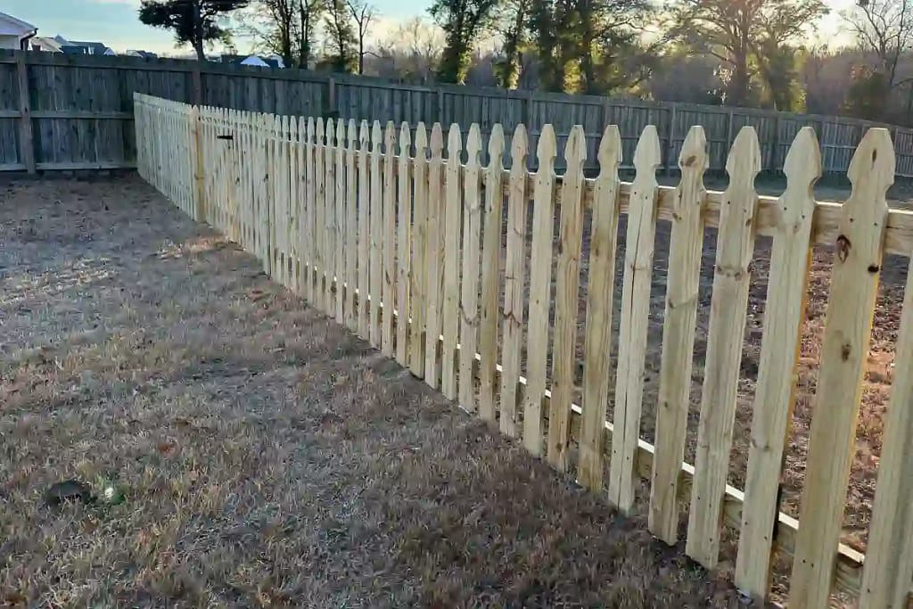 Wooden picked fence in Hampstead from Element Fence Company
