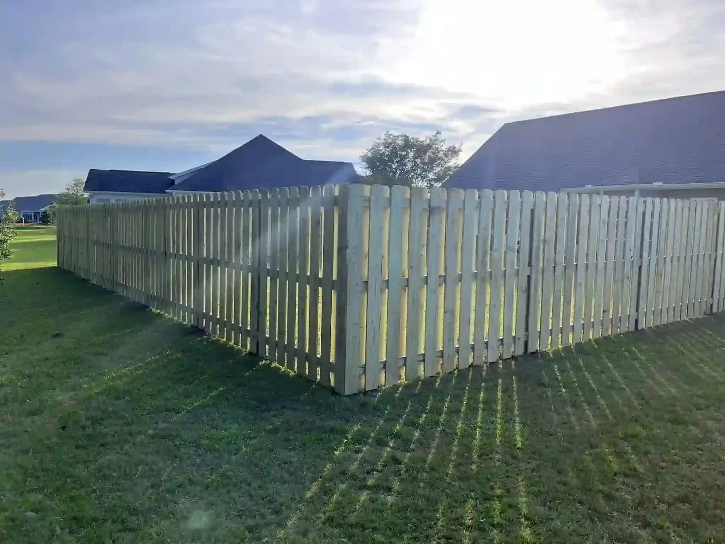 The sun shining over a beautiful Element Fence Company project somewhere in Wilmington, NC
